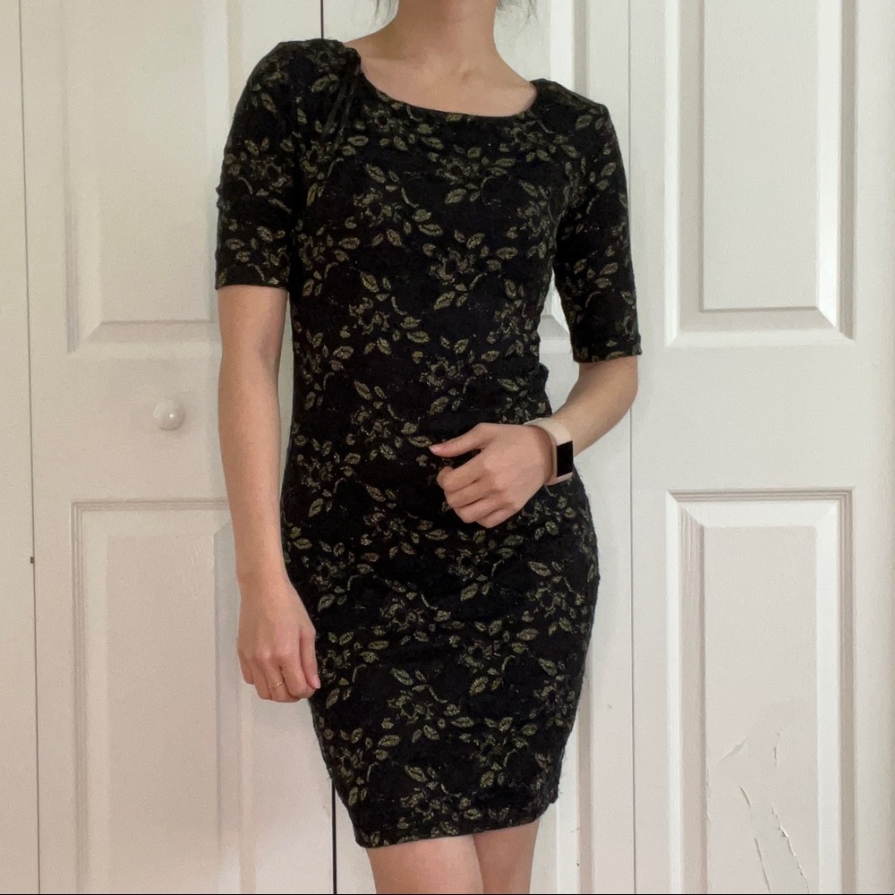 Sparkly black bodycon dress with gold leaf detailing